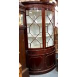 A Georgian mahogany floor standing corner cabinet