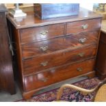 A 19th century mahogany chest of two short over three long drawers with brass handles, raised on