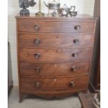 A Victorian mahogany bowfront chest of four graduating drawers with turned mother-of-pearl inlaid