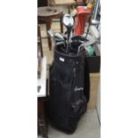 A black Memphis golf bag containing various clubs including a part set of Great White irons, Tony