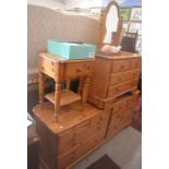 A Ducal pine bedroom suite comprising: a large eight drawer double chest, a four drawer chest,
