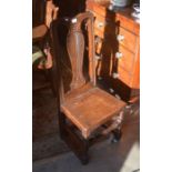 A provincial Queen Anne style carved oak hall chair