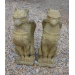 A pair of composite cast griffin statues