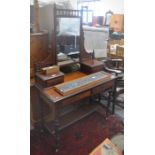 An Edwardian mahogany mirror backed dressing table with two frieze drawers, raised on turned
