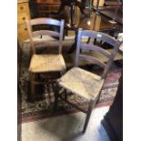 A pair of vintage rush seat side chairs (2)