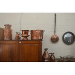 A collection of antique copper ware including a large saucepan with wrought iron handles,  Magness &