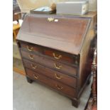 A Georgian mahogany fall front bureau with fitted interior, two short and three long drawers