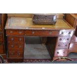 A 19th century mahogany twin pedestal desk with gilt tooled inset leather top over nine drawers with