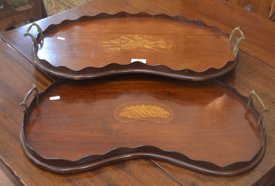 Two Victorian inlaid mahogany kidney-shaped galleried trays with brass handles (2)