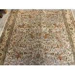 An Indo-Persian Tabriz pictorial carpet with hunting scenes surrounded by stylised floral and