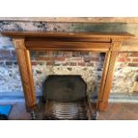 A Victorian style pine fire surround