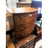 A 19th century mahogany bowfront commode chest of four long drawers