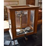 A mahogany cased set of laboratory chemical scales
