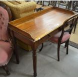 A 19th century mahogany hall table with galleried top raised on turned supports