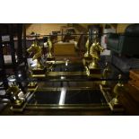 A small Maison Charles two-tier rectangular glass top coffee table, brass and burr walnut frame with