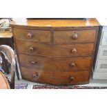 A 19th century mahogany bowfront chest of two short over three long drawers with turned handles (A/