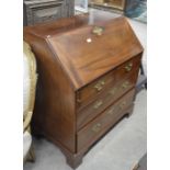 A 19th century mahogany fall front bureau with fitted interior over two short and two long drawers