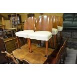 A walnut veneered Art Deco dining table (a/f) to/w a set of six Art Deco dining chairs with cream