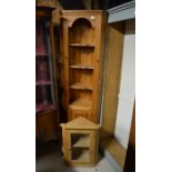 A slender pine floor standing corner cabinet with open shelves panelled door to/w wall hanging ash