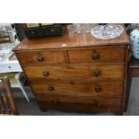 A 19th century mahogany chest of two short over three long drawers with turned handles, raised on