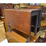 A 19th century mahogany drop leaf dining table