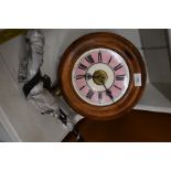 A circular pine framed Post Office wall clock with pendulum and weights