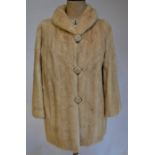 A blond mink long-line jacket