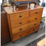 A Victorian mahogany chest of two short over three long drawers with turned handles and short turned