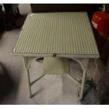 A cream painted Lloyd Loom style square side table with glass top