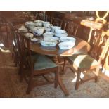 A 19th/20th century mahogany twin pedestal dining table, with single central leaf, raised on a