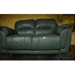 A textured green leather two-seater sofa