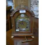 An Elliot burr wood cased twin-train mantel clock, c/w key