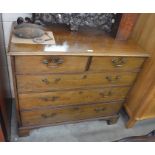 A George III mahogany chest of two short over three long drawers with brass swan-neck handles,