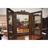 WITHDRAWN - A triptych decorative gilt framed dressing table mirror surmounted by a ribboned bow