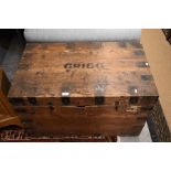 An old iron bound pitch pine trunk, with carrying handles to sides and stencilled letters for '