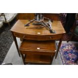 A Victorian mahogany inlaid bowfront side table with single frieze drawer raised on tapering