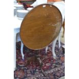 A 19th century mahogany tilt-top tripod table with turned column and triform supports