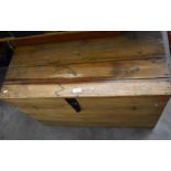 A large waxed slatted pine and iron bound storage trunk