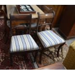 A harlequin set of six Regency style mahogany dining chairs with blue and white striped pad seats (
