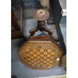 A Victorian inlaid walnut work/chess table with turned column and carved triform supports (f/r)