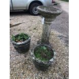 A weathered cast composite stone pedestal bird bath to/w a pair of weathered cast planters (3)