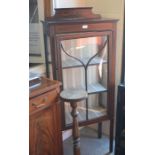 An Edwardian inlaid mahogany glazed display cabinet with single door enclosing two shelves