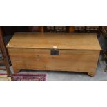 An antique pine blanket chest