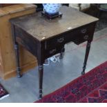 A small oak side table with three drawers and turned supports - makers label for T.G.Woof Ltd