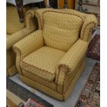 Three matching wing back arm chairs with yellow lattice pattern upholstery, raised on turned bun