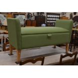 Wesley Barrell design ottoman window seat with green upholstery and tapering square oak supports