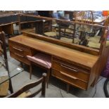 A mid century G-Plan style teak dressing table with full width rectangular mirror over six