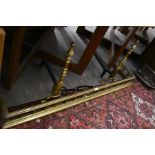 A Victorian heavy brass fender c/w pair of fire iron rests, a steel and mesh triple spark guard,