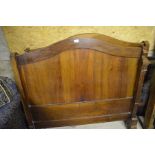An early 20th century rosewood ached double bed head and footboards a/f