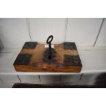 An antique oak lock with ornate iron mounts c/w key